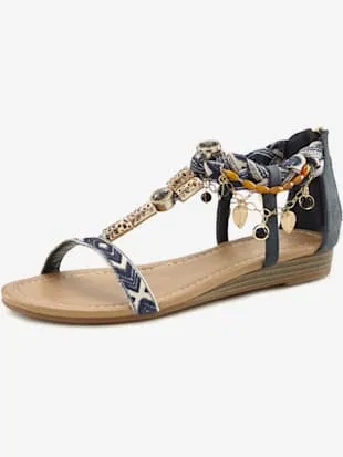 Wedge sandals with decorative elements.